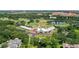 Picturesque aerial view of a golf course, ponds, and the clubhouse at 476 Water St, Celebration, FL 34747