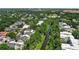 Stunning aerial view showcases a residential area nestled amongst trees and a canal at 476 Water St, Celebration, FL 34747