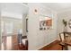 Open-concept dining room view to kitchen featuring hardwood floors at 476 Water St, Celebration, FL 34747