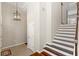Entryway featuring tile floors and wooden staircase at 476 Water St, Celebration, FL 34747