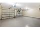 Spacious three car garage with epoxy flooring and ample storage space for vehicles at 476 Water St, Celebration, FL 34747