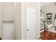 Hallway featuring hardwood floors, with access to basement stairs at 476 Water St, Celebration, FL 34747