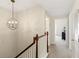 Hallway featuring carpet floors and a decorative light fixture at 476 Water St, Celebration, FL 34747