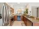 Updated kitchen featuring granite countertops, wine fridge, and stainless steel appliances at 476 Water St, Celebration, FL 34747