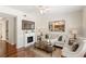 Cozy living room features a fireplace, a comfortable sofa, and stylish decor at 476 Water St, Celebration, FL 34747
