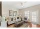 Comfortable living room with hardwood floors, natural light, and a stylish sofa at 476 Water St, Celebration, FL 34747