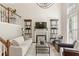 Elegant living room features high ceilings, decorative shelves, and designer furnishings at 476 Water St, Celebration, FL 34747