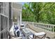 Relaxing outdoor patio with comfortable seating, a modern fire pit, and white railing at 476 Water St, Celebration, FL 34747