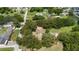 Aerial view of a property with a red box boundary in a lush, green, tree filled neighborhood at 485 Palm St, Winter Garden, FL 34787