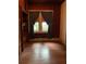 Bedroom with vintage curtains, wood floors, and natural light at 485 Palm St, Winter Garden, FL 34787