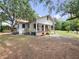 Single Gathering home featuring a welcoming front porch and serene outdoor ambiance at 485 Palm St, Winter Garden, FL 34787