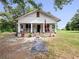 Attractive single Gathering home with charming front porch and beautifully landscaped front yard at 485 Palm St, Winter Garden, FL 34787