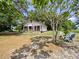Charming one-story home with a cozy front porch, fire pit, and a spacious, tree-shaded yard at 485 Palm St, Winter Garden, FL 34787