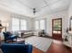 Bright living room featuring hardwood floors, a comfortable sectional sofa, and natural light from large windows at 485 Palm St, Winter Garden, FL 34787