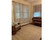 Bright room with piano, rocking chair, and large patterned area rug at 485 Palm St, Winter Garden, FL 34787