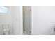 Bright bathroom showcases modern glass shower, sleek toilet, and airy, minimalist design at 509 St. Johns Ct, Poinciana, FL 34759