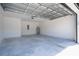 Spacious garage with overhead door, ample storage capacity, and ready for any automotive or storage needs at 509 St. Johns Ct, Poinciana, FL 34759