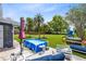 Back patio featuring an above ground pool, lounge furniture, and spacious yard, ideal for relaxation and enjoyment at 5384 Barton Dr, Orlando, FL 32807