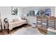 Cozy bedroom with a daybed, hardwood floors, a window with natural light, and ample storage space at 5384 Barton Dr, Orlando, FL 32807
