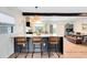 Charming kitchen featuring stainless steel appliances, custom cabinets, a large island, and breakfast bar seating at 5384 Barton Dr, Orlando, FL 32807