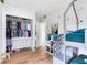 A room with bunk beds, hardwood floors, whimsical decor, and ample closet space at 5384 Barton Dr, Orlando, FL 32807