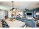 Open-concept living space with modern furnishings and decor, connecting to the kitchen and dining area at 564 Southern Edge Way, Sanford, FL 32771