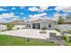 A beautifully paved backyard patio with a built-in fire pit is perfect for hosting Gathering and friends at 6013 Mount Zion Cir, Deland, FL 32724
