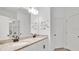 Elegant bathroom with a double sink vanity, granite countertop, and framed mirror at 6013 Mount Zion Cir, Deland, FL 32724