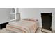 Simple bedroom with a comfortable bed and a modern decor at 6013 Mount Zion Cir, Deland, FL 32724
