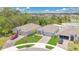 Aerial view of three charming homes with manicured lawns and paved driveways in a desirable neighborhood at 6013 Mount Zion Cir, Deland, FL 32724