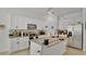 Modern kitchen with stainless steel appliances, granite countertops, and sleek white cabinetry at 6013 Mount Zion Cir, Deland, FL 32724