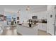 Bright kitchen with a large island, granite countertops, and stainless steel appliances at 6013 Mount Zion Cir, Deland, FL 32724