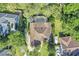 A picturesque aerial view of a well-kept home, highlighting its private, screened-in pool and pristine yard at 612 Golden Dawn, Apopka, FL 32712
