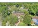 Aerial view of the home showcasing a screened in pool and beautiful mature trees providing lots of privacy at 612 Golden Dawn, Apopka, FL 32712