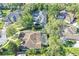 Aerial view of property showcasing a large, screened-in pool, patio area and meticulously maintained landscaping at 612 Golden Dawn, Apopka, FL 32712