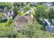 An aerial view of a well-maintained home featuring a screened-in pool, and spacious driveway at 612 Golden Dawn, Apopka, FL 32712