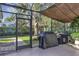 A covered grill area with two grills and a view of the backyard at 612 Golden Dawn, Apopka, FL 32712