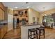 Stylish kitchen with stainless steel appliances, granite countertops, and a breakfast bar with seating for two at 612 Golden Dawn, Apopka, FL 32712