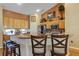 Kitchen with granite countertops, stainless steel appliances, and bar seating at 612 Golden Dawn, Apopka, FL 32712