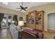 Comfortable living room with wood floors, ceiling fan and built-in entertainment center at 612 Golden Dawn, Apopka, FL 32712