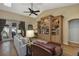 Comfortable living room with wood floors, ceiling fan and built-in entertainment center at 612 Golden Dawn, Apopka, FL 32712