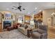 Inviting living room featuring a fireplace and a view of the kitchen area with bar seating at 612 Golden Dawn, Apopka, FL 32712