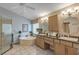 Bright main bathroom with double sinks, vanity, soaking tub, walk-in glass shower and natural light at 612 Golden Dawn, Apopka, FL 32712