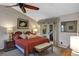 Spacious main bedroom with vaulted ceiling, ceiling fan, and cozy seating area and accent pillows at 612 Golden Dawn, Apopka, FL 32712