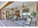 Covered outdoor patio area featuring comfortable seating, ceiling fans, and elegant lighting for relaxing and entertaining at 612 Golden Dawn, Apopka, FL 32712