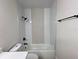Bathroom featuring a tub with shower, white vanity with solid surface counter at 6554 Meritmoor Cir, Orlando, FL 32818