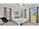 Cozy bedroom with natural light, neutral carpet, white walls, and a comfortable bed at 708 S Laurel Ave, Sanford, FL 32771