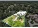 Aerial view showcasing the property's expansive lot, modern home design, and beautifully maintained landscaping at 7615 Se 12Th Cir, Ocala, FL 34480