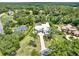 Sprawling home surrounded by lush greenery, showcasing the home's well manicured lawn at 7615 Se 12Th Cir, Ocala, FL 34480