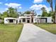 Stunning modern house with professional landscaping and a contemporary design at 7615 Se 12Th Cir, Ocala, FL 34480